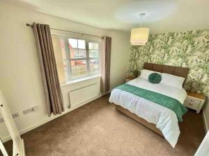 a bedroom with a bed and a window at Whessoe House by Blue Skies Stays in Stockton-on-Tees