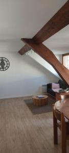 a living room with a couch and a table at Appartement lumineux Berck plage in Berck-sur-Mer