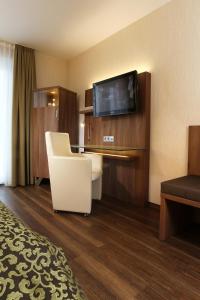 TV a/nebo společenská místnost v ubytování Hotel Simonshof
