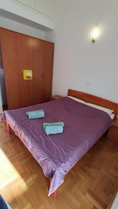 A bed or beds in a room at Apartman Sael, Medulin