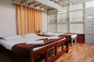 Ένα ή περισσότερα κρεβάτια σε δωμάτιο στο Kudajadri Drizzle Homestay