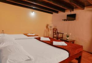Ένα ή περισσότερα κρεβάτια σε δωμάτιο στο Kudajadri Drizzle Homestay