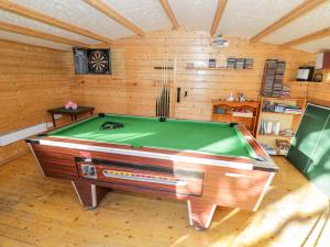 a room with a pool table in a cabin at The Orangery in Worcester
