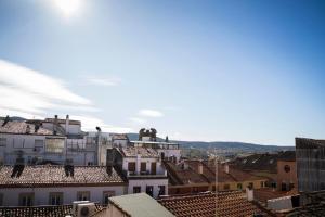 a view of roofs of buildings in a city at Hostal Goyesco Plaza in Plasencia