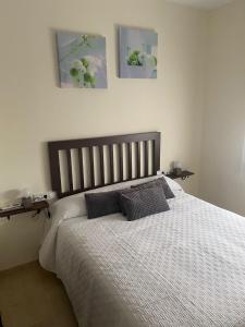 Posteľ alebo postele v izbe v ubytovaní APARTAMENTO TURÍSTICO VEGA HOUSE
