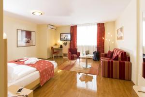 Ένα ή περισσότερα κρεβάτια σε δωμάτιο στο Hotel Amaris