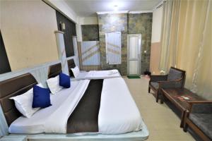 Voodi või voodid majutusasutuse Mahadev Hotel and Resorts toas