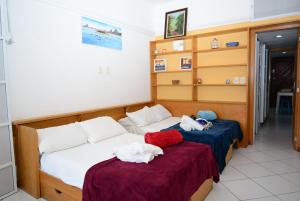 Un pat sau paturi într-o cameră la Mar de Copacabana - Praia