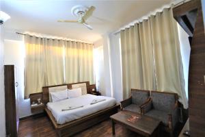 Voodi või voodid majutusasutuse Mahadev Hotel and Resorts toas