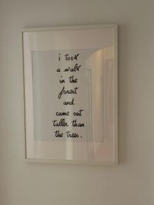 a framed picture of a poem on a wall at La Oliverica in Caudete