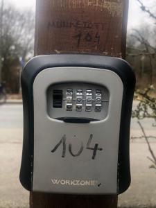 a parking meter attached to a telephone pole at Stadtnah an der Förde 104 in Flensburg