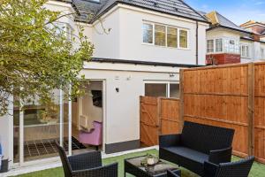 a home with a backyard with a fence at Star London Vivian Avenue 2-Bed Retreat with Garden in The Hyde