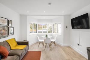 a living room with a couch and a table at Star London Vivian Avenue 2- Bed Abode in The Hyde