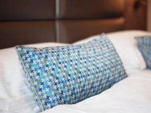 Postel nebo postele na pokoji v ubytování Drei Kronen Hotel Wien City