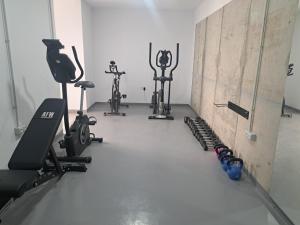 a gym with several exercise bikes and tread machines at Calma Suites Tejeda in Tejeda