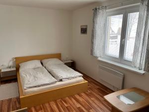 Postel nebo postele na pokoji v ubytování Apartmán Strážný