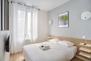 Posteľ alebo postele v izbe v ubytovaní Residence Center of Paris by Studio prestige