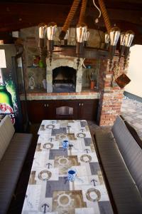 a long table in a room with a fireplace at Matteo in Malinska