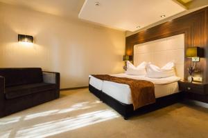 Voodi või voodid majutusasutuse Duna Garden Hotel toas