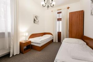 Postel nebo postele na pokoji v ubytování Vila Vyšehrad