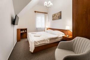 Postel nebo postele na pokoji v ubytování Vila Vyšehrad