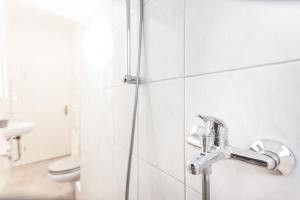 a bathroom with a shower and a toilet at TM Aparts in Dortmund