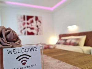 a welcome sign in a room with a living room at Getaway Pri Kobalu in Vipava