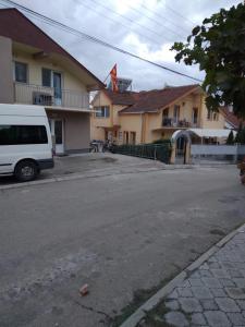 a white van parked in front of a building at VILLA SIMKA in Kočani