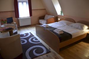Posteľ alebo postele v izbe v ubytovaní Hotel U Kozicky