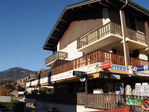 a building with balconies on the side of it at Appartement rénové avec mezzanine et balcon au cœur de Samoëns, idéal pour famille nombreuse - FR-1-624-69 in Samoëns