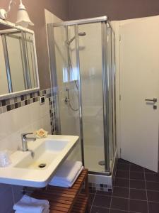 a bathroom with a sink and a shower at Appartamento Biancospino in Abbadia San Salvatore