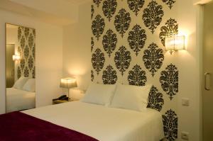 Postel nebo postele na pokoji v ubytování Hotel Genesis