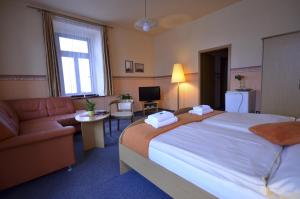 Posteľ alebo postele v izbe v ubytovaní Hotel U Kozicky