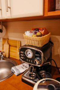 a toaster on a kitchen counter with a basket on top at Blue Holiday in Łukęcin