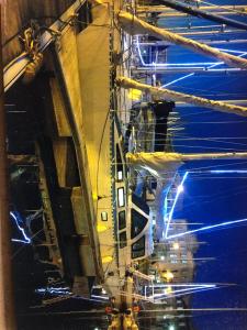 a man standing on a crane in a building at Cassiopee in Lorient