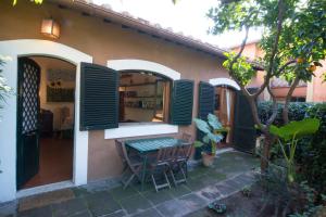 a patio with wooden shutters on a house at The Palatine Garden Apartment in Rome