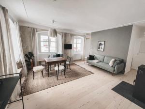 a living room with a couch and a table at kleines Stadthaus in Isny im Allgäu