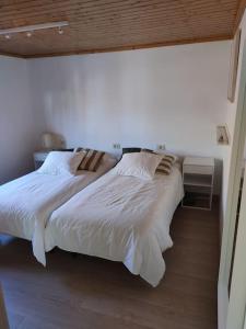 Postel nebo postele na pokoji v ubytování Ático Porto do Son