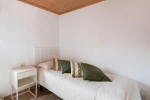 Postel nebo postele na pokoji v ubytování Ático Porto do Son