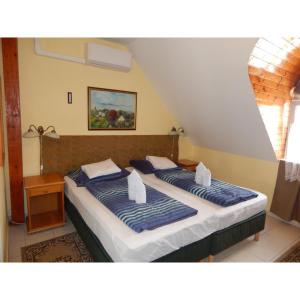 Voodi või voodid majutusasutuse Hotel Balaton Fonyód toas