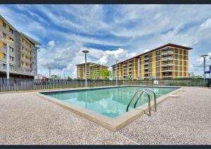 a swimming pool in the middle of a building at One-bed apartment at Darwin Waterfront Precinct in Darwin