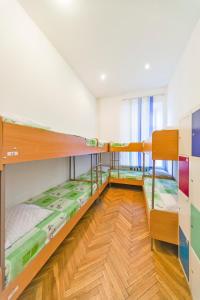 a room with three bunk beds in it at Hostel Muzeyny in Kyiv +36 photos