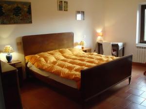 מיטה או מיטות בחדר ב-Agriturismo Cà Rossano