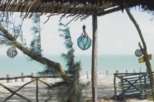 a view of the beach from a beach house at Na Beira do Mar Pousada in Prea