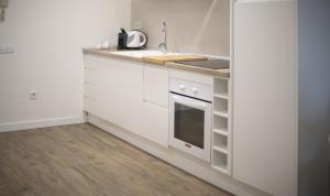 A kitchen or kitchenette at Clauhomes Vista Al Mar