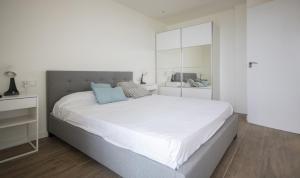 A bed or beds in a room at Clauhomes Vista Al Mar