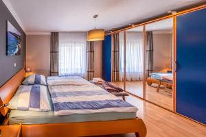 Postel nebo postele na pokoji v ubytování Ferienhaus CAMILLO