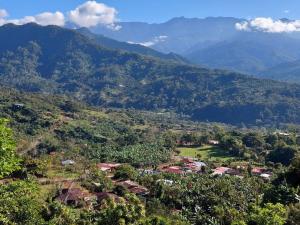 a village in a valley with mountains in the background at Jessie's Country House Rivas in Rivas