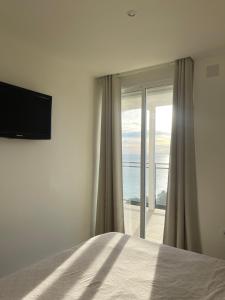A bed or beds in a room at Clauhomes Vista Al Mar