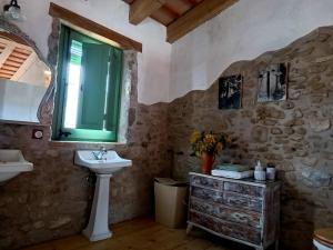 a bathroom with a sink and a window at Vivalidays Casa Rural Anna Mieres Gerona in Mieres +39 photos